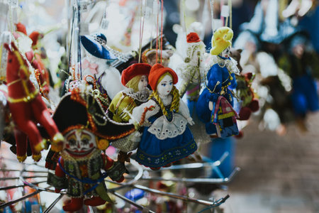 Handmade dolls in the form of figures at the Christmas market at the town hall of the city in Europe close-up. High quality photoの写真素材