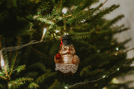 Decorated christmas live tree with garland and christmas ball of owl for holidays and gifts. High quality photoの写真素材