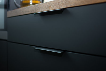 Kitchen cabinet with matte fronts and wooden countertopの写真素材