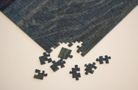 Meadow puzzle on a white table, partially assembled with gaps and loose pieces
