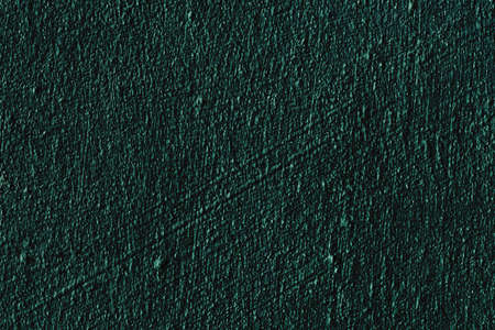 Grunge dark green old abstract background in vintage design with porous texture, scratches and lines. The art of rough stylized texture.の写真素材
