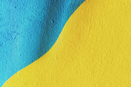 National Yellow and Blue Flag of Ukraine painted on beautiful textured concrete wall. copyspace.の写真素材