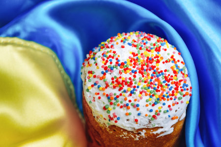 Delicious Easter cake with multicolored sweet delicious topping and icing in the State Yellow and...