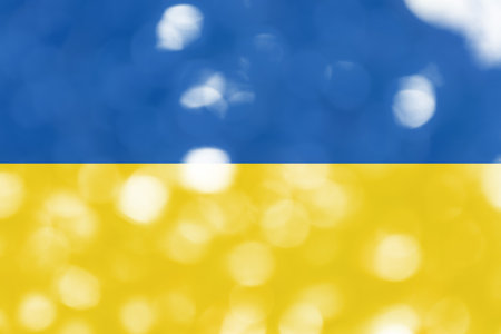 Defocused bright abstract State Flag of Ukraine with white shimmering sunspots. bokeh. holiday concept. Copy space for text.の写真素材