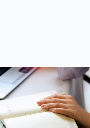 Woman's hand on a notebook sitting at the arrow. letter. training. study concept.
