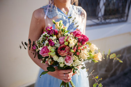 Wedding bouquet in girls hands.の写真素材