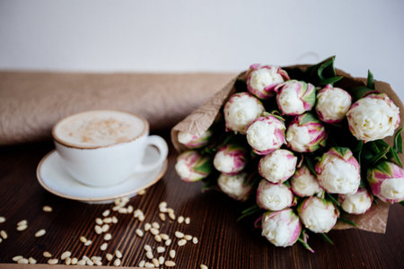 Cappuccino with nuts on the table.の写真素材