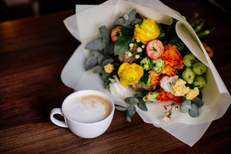 Coffee and flowers bouquet.の写真素材