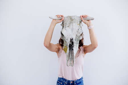 Girl with a skull of an animal.の写真素材