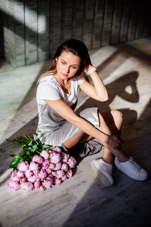 Bouquet of peonies in hands.の写真素材