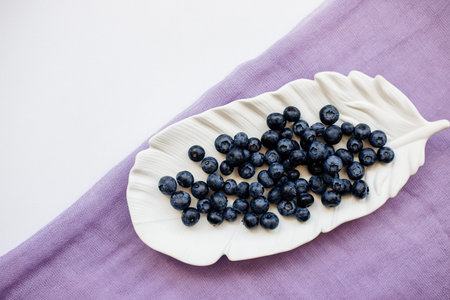 Blueberries on a white table.の写真素材