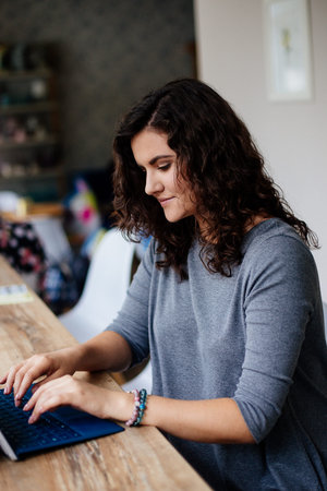 Girl with a laptop in a cafe.