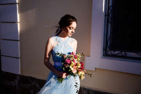 Wedding bouquet in girls hands.の写真素材