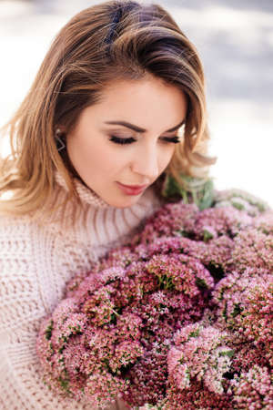 Image of cute woman with bouquetの写真素材