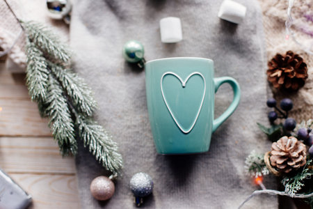 Cup of cocoa with marshmallows on table.