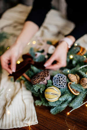 Beautiful christmas wreath n handsの写真素材