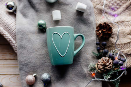 Cup of cocoa with marshmallows and cookies on table.の写真素材