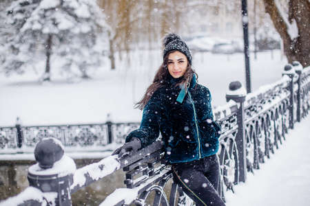 Snow girl portrait at winterの写真素材