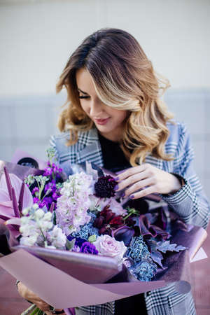 Image of cute woman with bouquetの写真素材