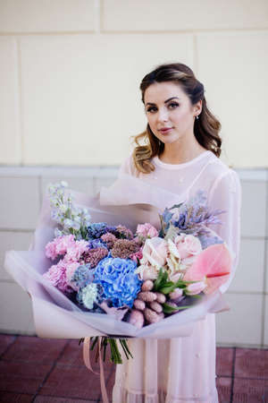 Image of cute woman with bouquetの写真素材