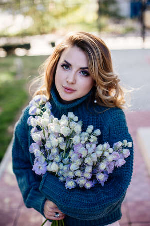 Image of cute woman with bouquetの写真素材