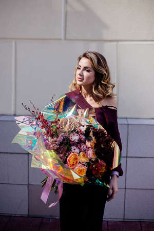 Image of cute woman with bouquetの写真素材