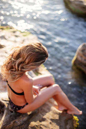 Beautiful woman by the seaの写真素材