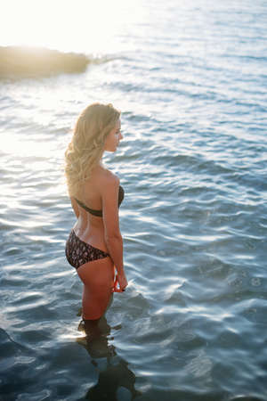 Beautiful woman by the sea.の写真素材
