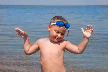 Emotions and a smile. A boy with blue eyes. Portrait of child.の写真素材