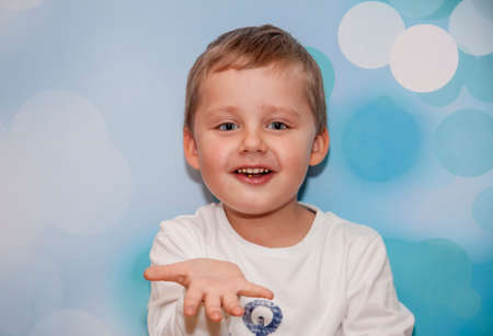 Child Emotions. Funny boy. A boy with blue eyes. Portrait.の写真素材