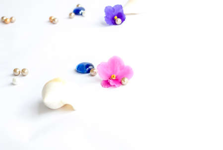 Background for the design. Beads. Green leaf. Various decor elements. Bright flowers. Light base.の写真素材