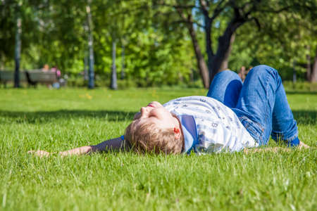 Warm may. Spring walk. Funny games for children on the lawn.の写真素材