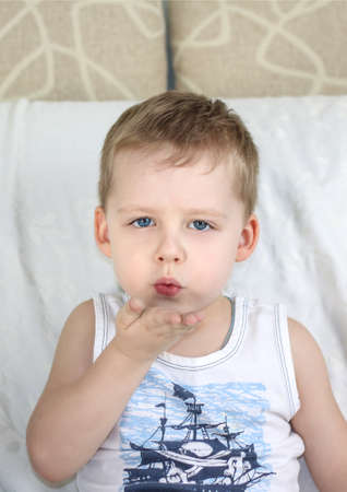 A boy with a funny expression on his face. Emotions, portrait.の写真素材