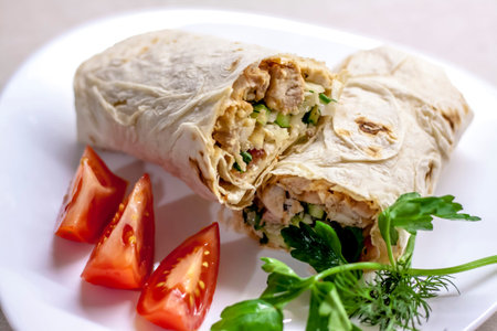 Cooking rolls with meat and vegetables. Roll in flatbread. Food preparation.の写真素材