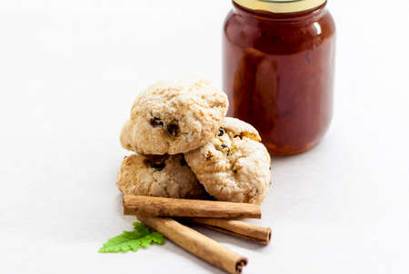 Fragrant cookies with cinnamon and jam. Sweets on the table. Light and light composition.の写真素材