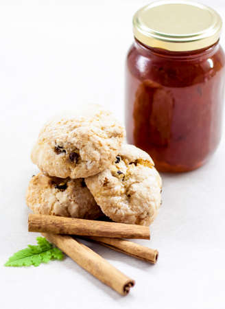 Fragrant cookies with cinnamon and jam. Sweets on the table. Light and light composition.の写真素材
