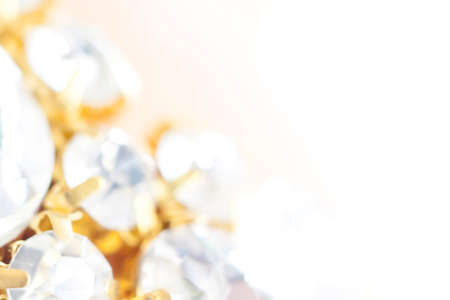 Background of abstract glittering lights. Blurred crystal beads for the background. Silver and gold. de-focus. Use it as a background for your presentation.の写真素材