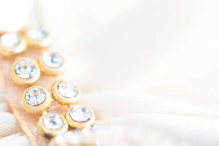 Background of abstract glittering lights. Blurred crystal beads for the background. Silver and gold. de-focus. Use it as a background for your presentation.の写真素材
