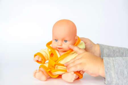 A child plays with a doll background.の写真素材
