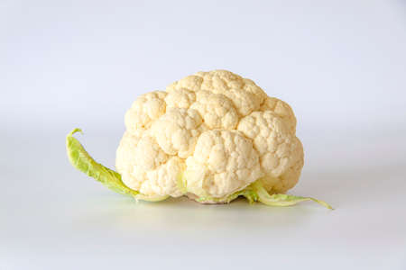 Whole cauliflower on a light background.  Raw cauliflower.の写真素材
