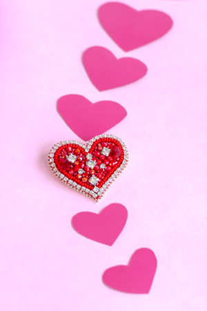 Red heart made of beads. Pink hearts. The concept of the Valentine's Day theme. A greeting card, a declaration of love. February 14の写真素材