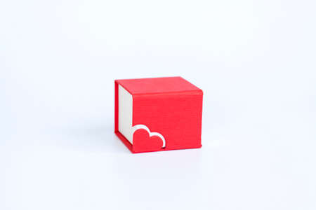Red box for decoration with a heart on a white background. Make a Declaration of love. The concept of the Valentine's Day theme. Isolate.の写真素材