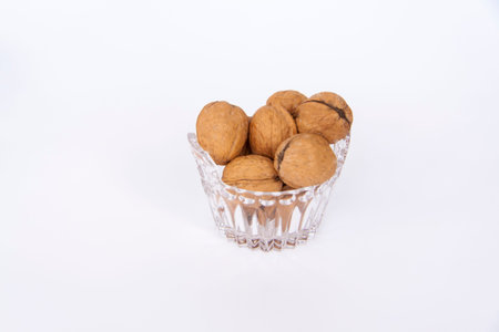 Walnuts in a shell on a white background. Healthy nuts. Walnuts.