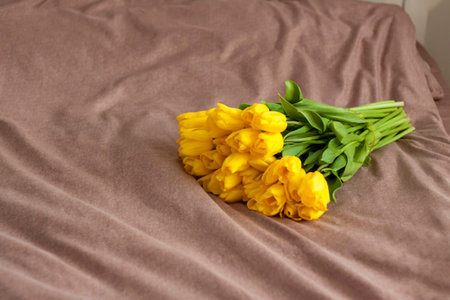 A bouquet of yellow tulips. Bouquet of fresh tulips close-up. Spring flowers in the interior. The...