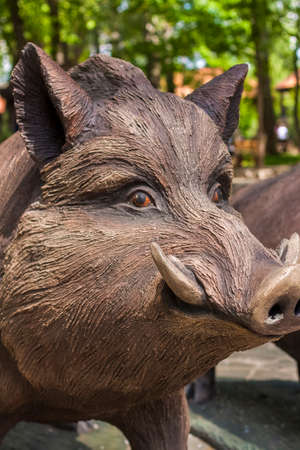 2021-05-07. Russia. Kamensk-Shakhtinsky, Rostov region. Beautiful decor elements in the park for tourists. Sculpture of a wild boar. LOGA Landscape Parkのeditorial素材