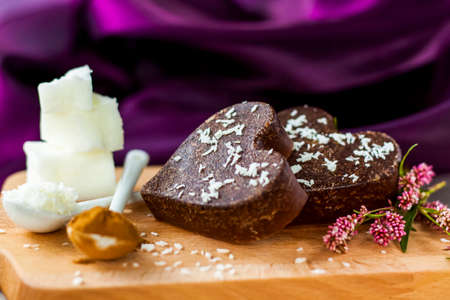 on the table there are handmade chocolates made of coconut oil, coconut chips and cocoa. dessert according to the recipe of proper nutrition. diet for weight lossの写真素材