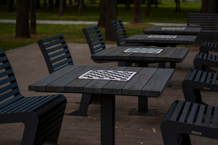 There are chess tables for everyone in the park. city playgroundsの写真素材