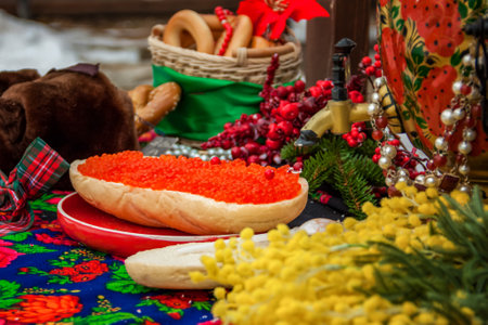 Red caviar is spread on bread with a thick layer. Maslenitsa street fair. outdoor foodの写真素材