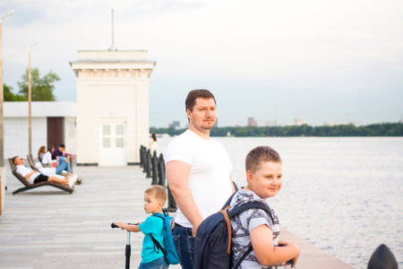 2022-07-17. Russia. Moscow. Northern River Station. Promenade. Walking along the embankment on scooters on a summer day.のeditorial素材