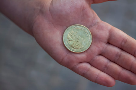 2022-08-16 Russia, Samara, Tourist center "Castle Garibaldi" in the village of Khryashchevka, Samara region. Newly minted commemorative coin in handのeditorial素材